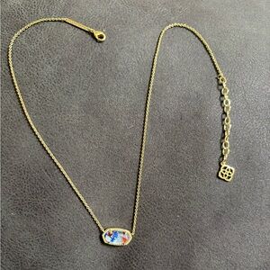 Kendra Scott gold necklace with red, white, and blue stars pendant